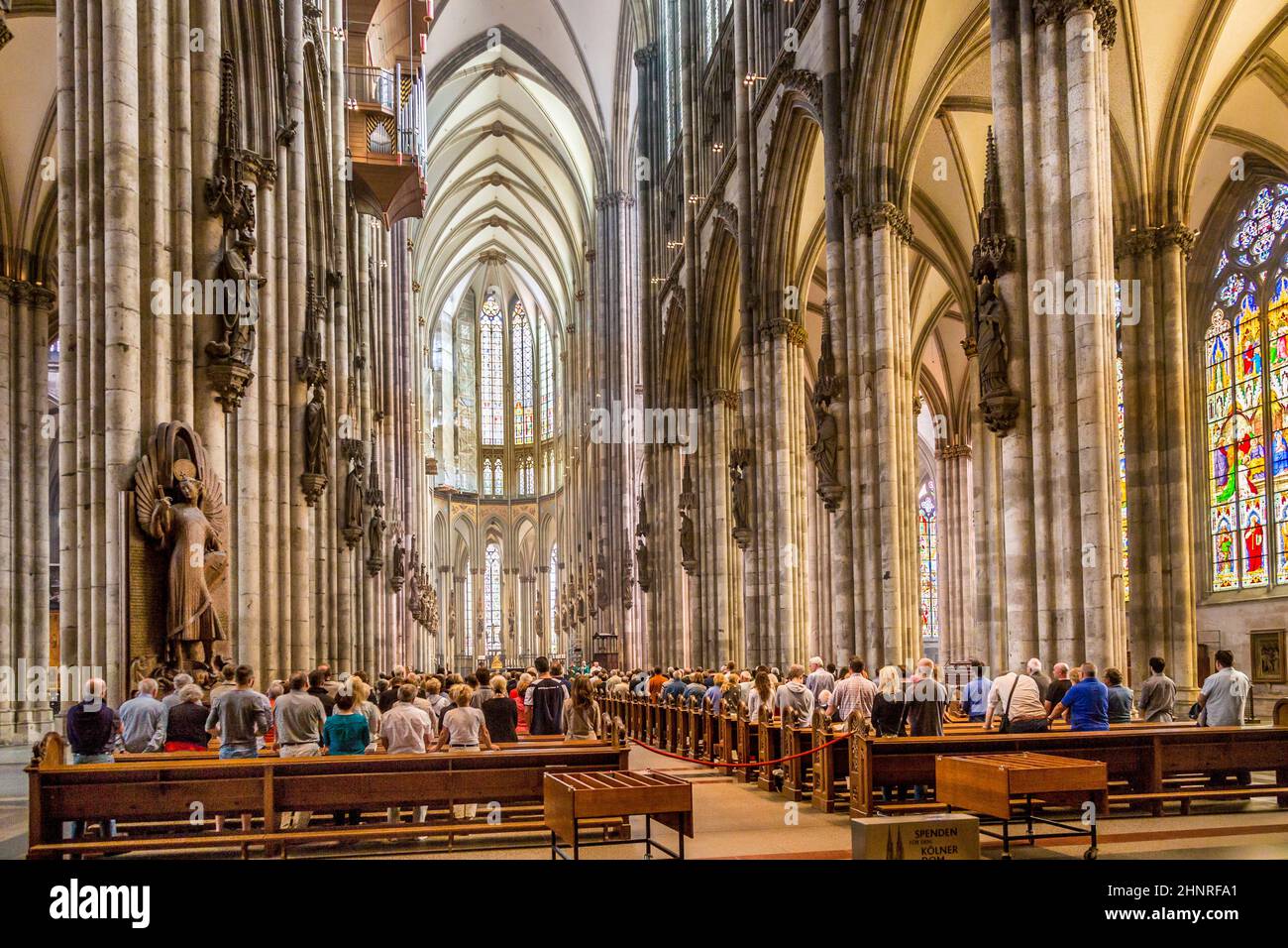 service held in Central nave of Cologne Cathedral, Germany Stock Photo