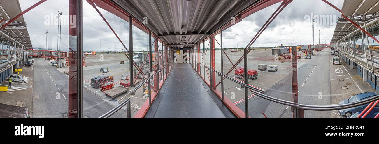 inside the new Terminal at the airport in Hamburg with view to the apron and waiting aircrafts Stock Photo