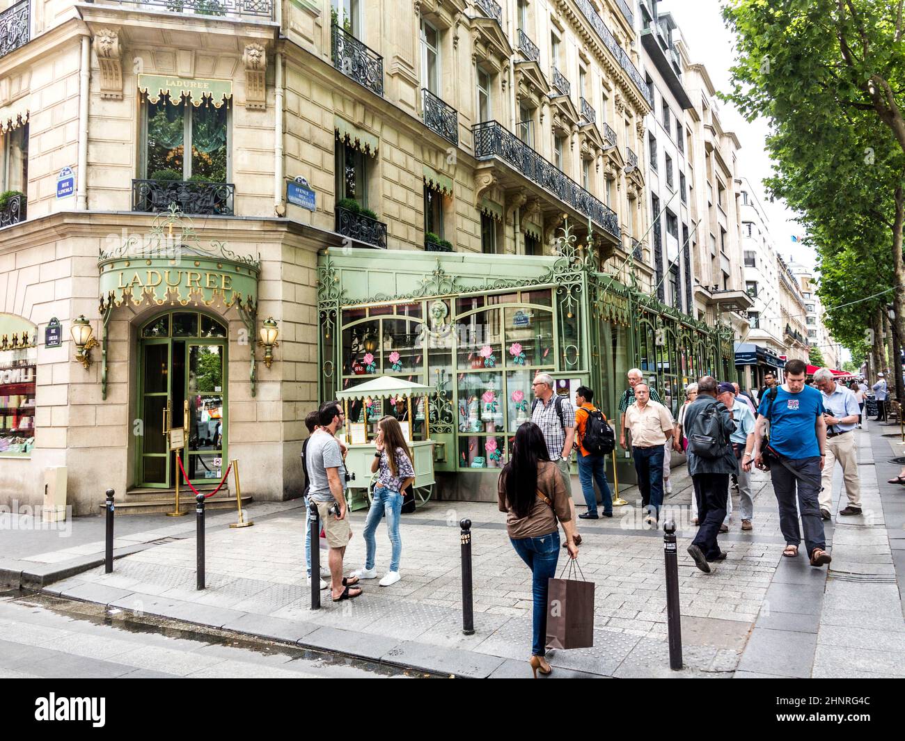 people in front of LADUREE shop at champs elysees Stock Photo