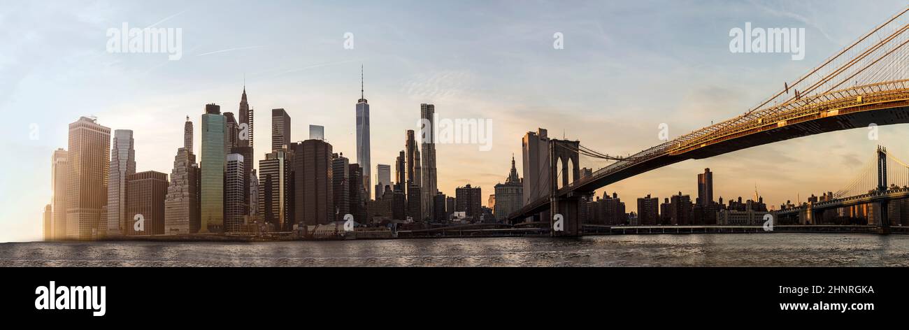 skyline of New York with brooklyn bridge in sunset Stock Photo