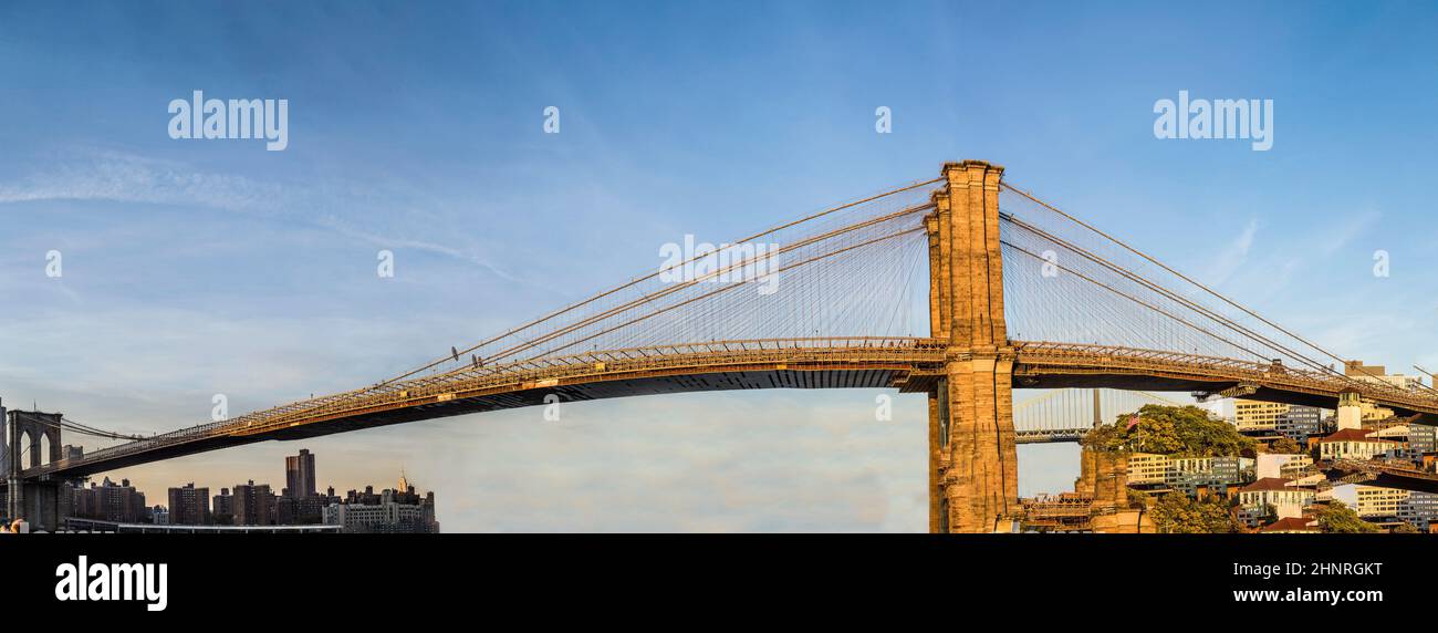 skyline of New York with brooklyn bridge in sunset Stock Photo