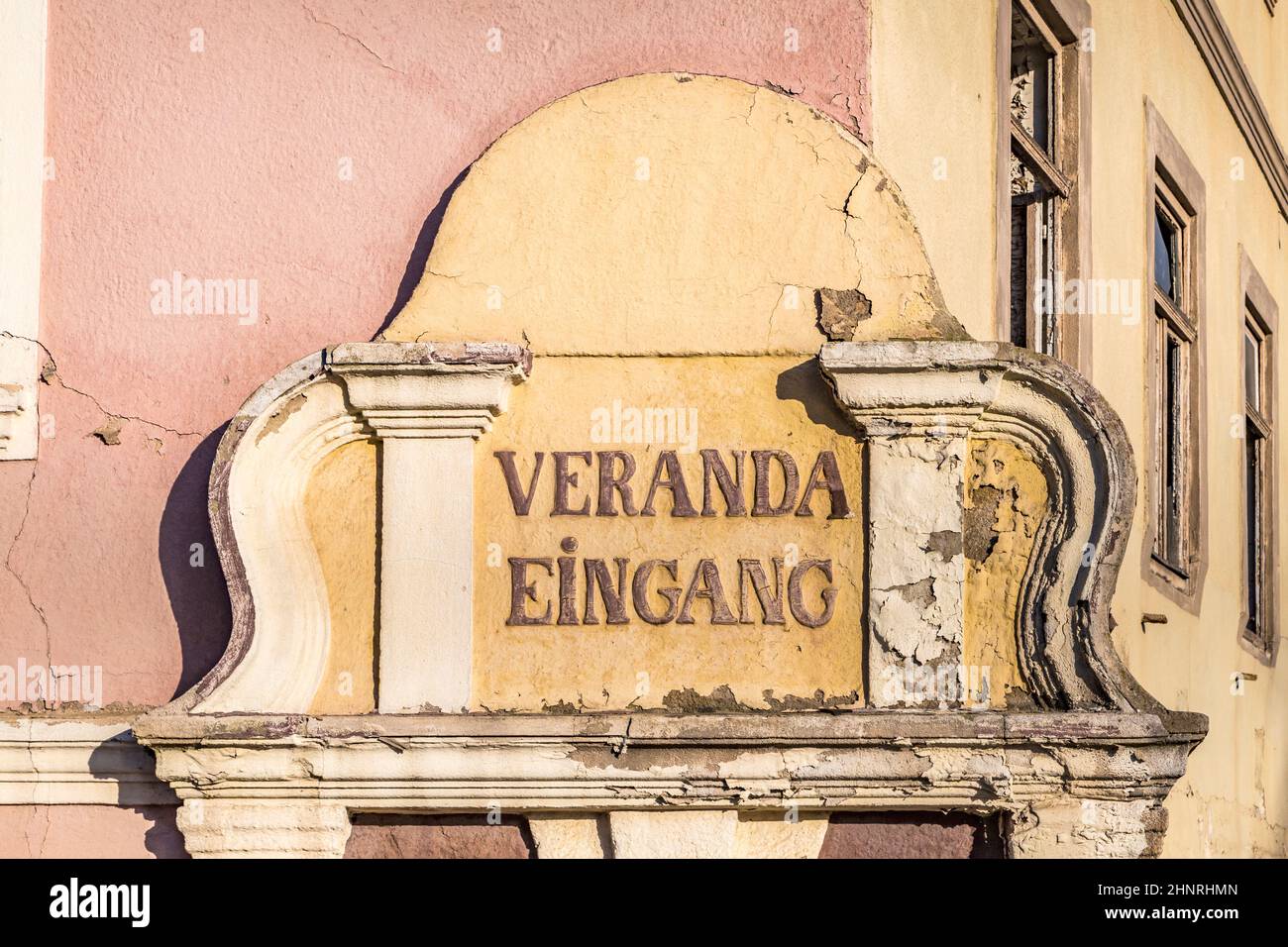 sign entrance terracce at an old rotten broken down house Stock Photo