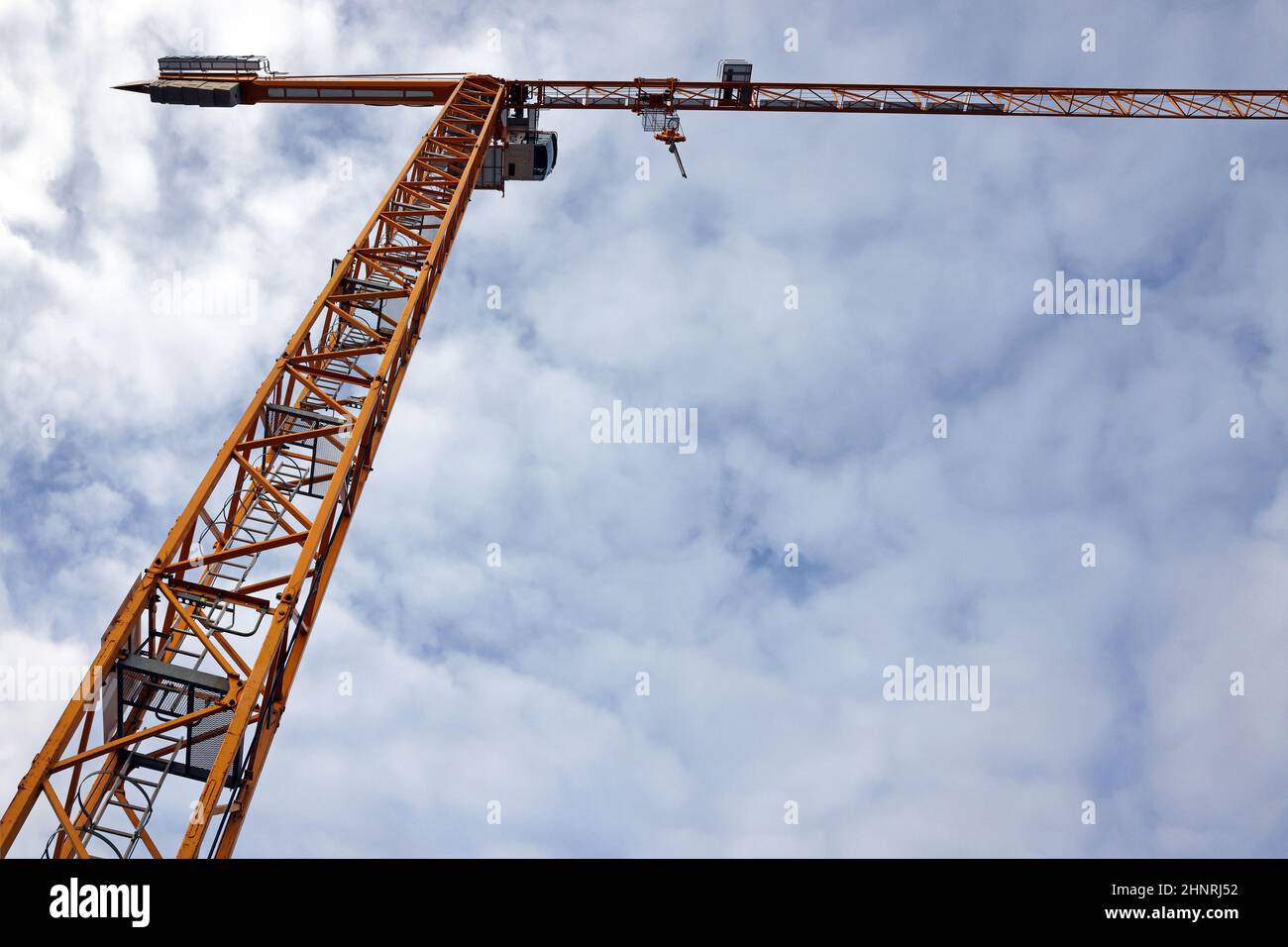 construction crane against the cloudy sky Stock Photo - Alamy