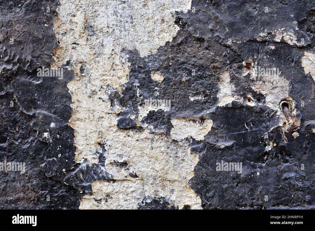 Detailed close up view on aged concrete walls with cracks and lots of