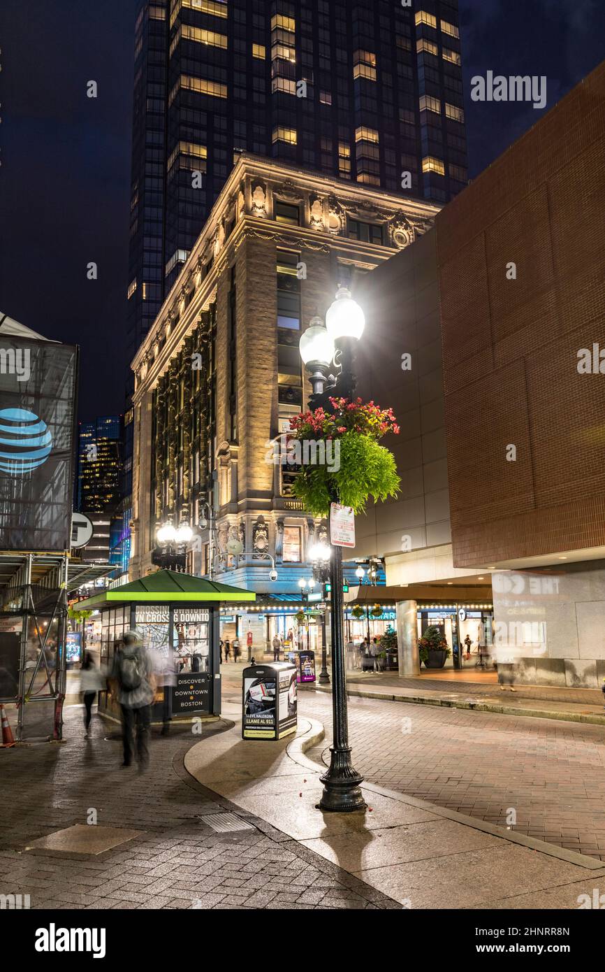 people enjoy shopping in the pedestrian zone at Washington street at night Stock Photo