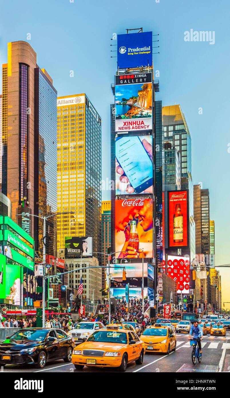 people enjoy times square with neon advertising of News, brands and theaters Stock Photo