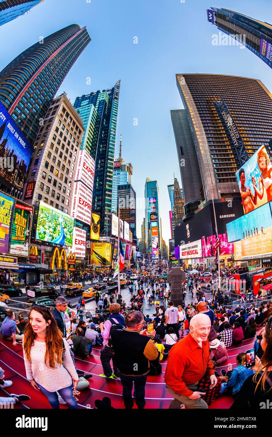 neon advertising of News, brands and theaters at times square in late afternoon Stock Photo