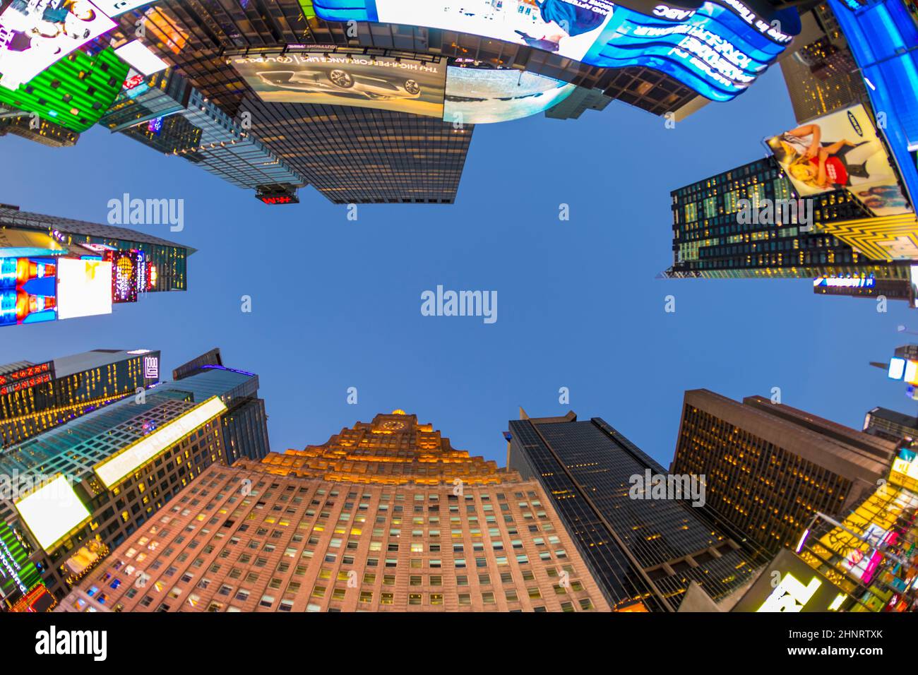 neon advertising of News, brands and theaters at times square in late afternoon Stock Photo