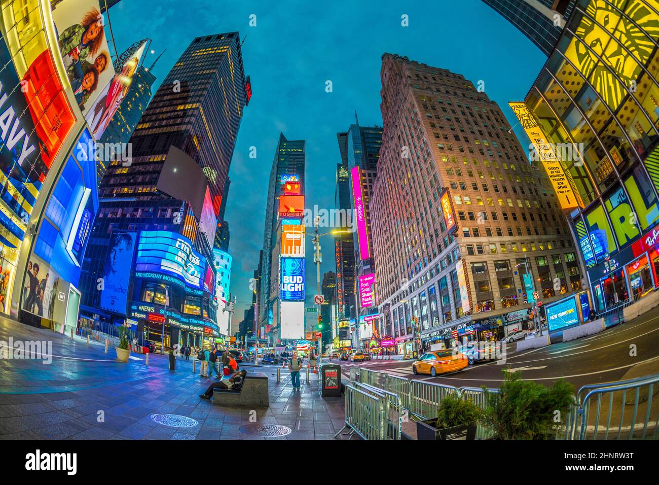 neon advertising of News, brands and theaters at times square in late afternoon Stock Photo
