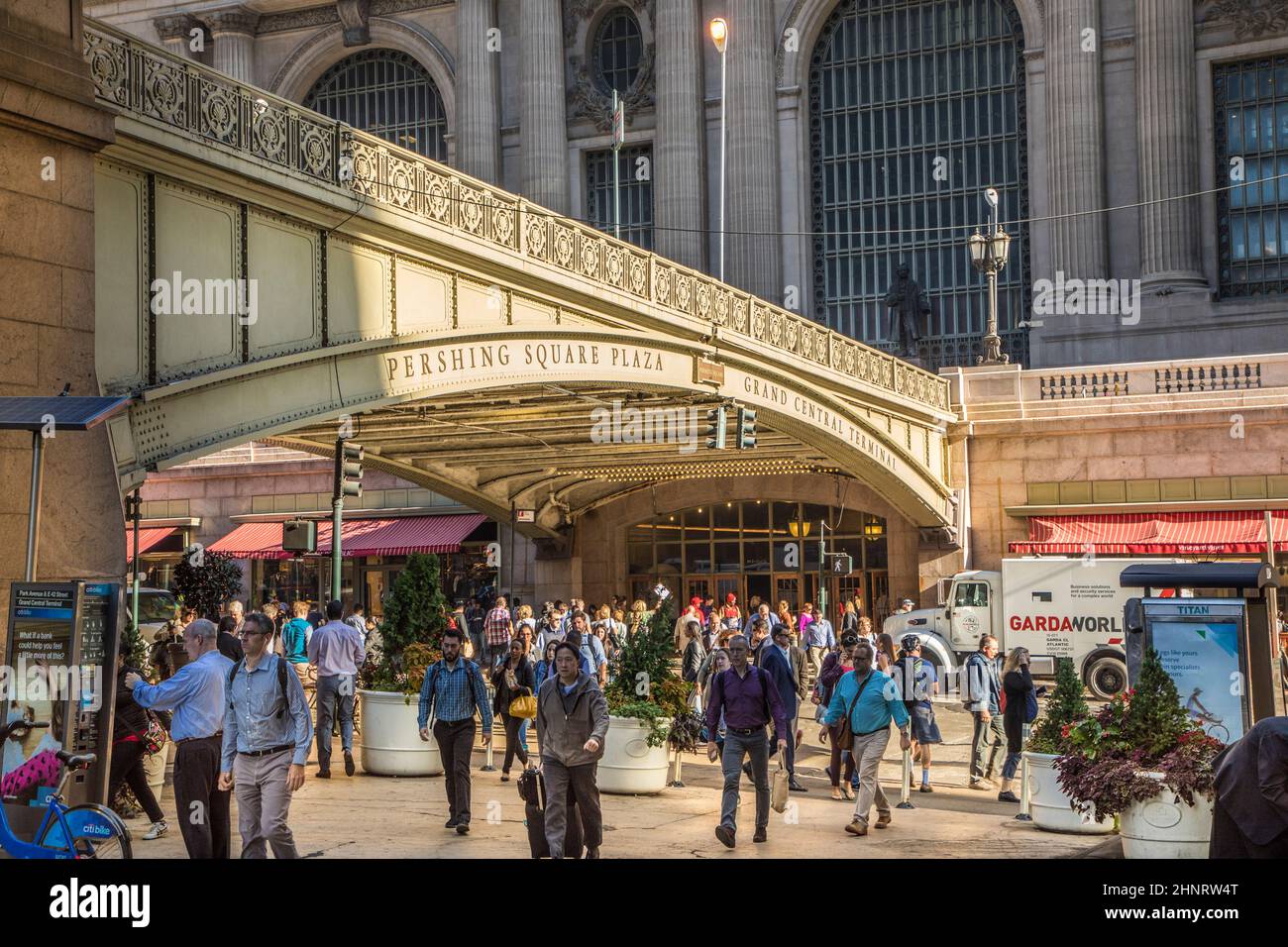 people hurry at persing square plaza in the crowded streets. Some arrive at Grand central station Stock Photo