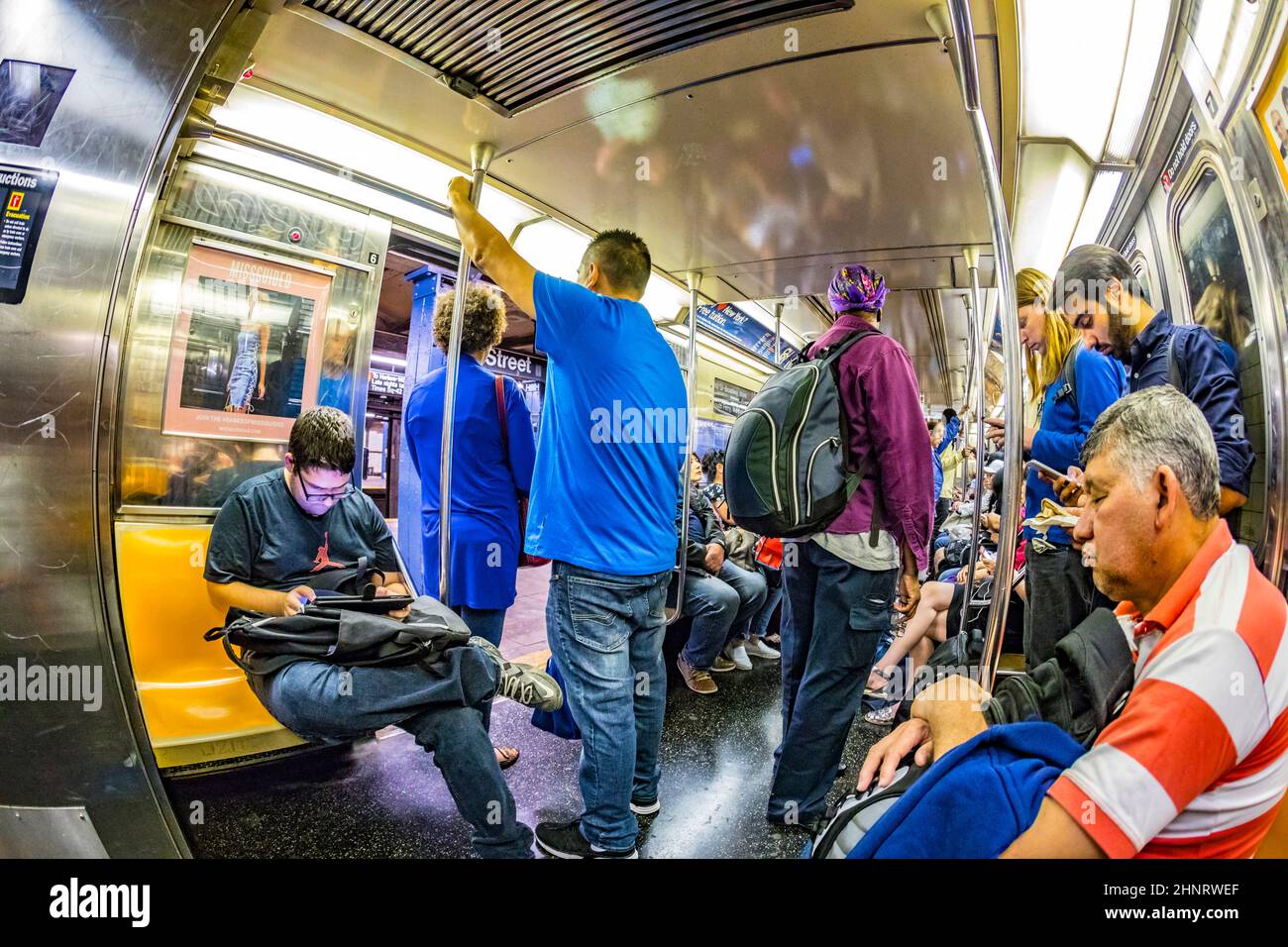people in the Metro at station 42d street in New York, trains to times square Stock Photo Alamy