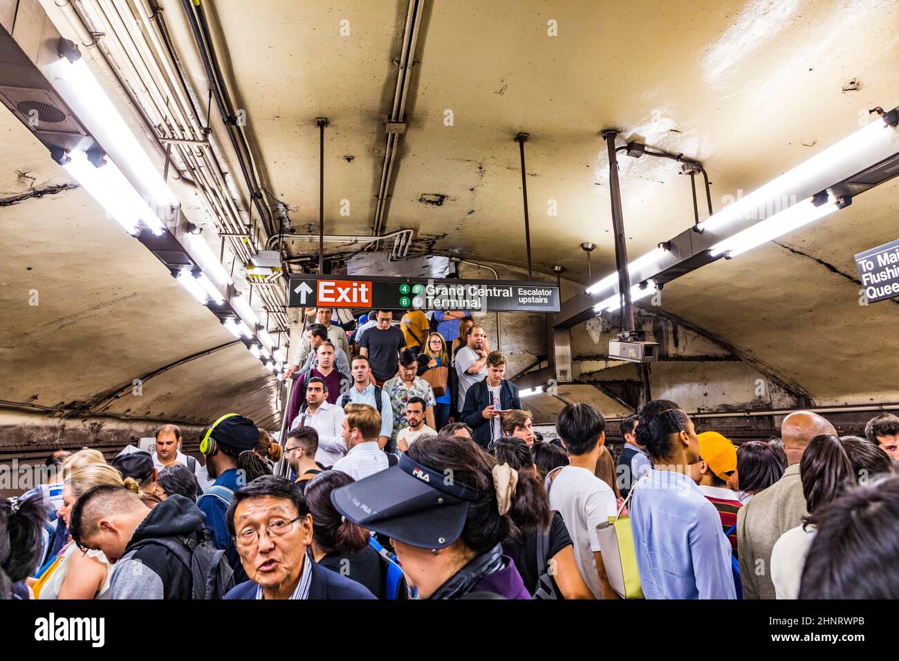 people at metro station Grand Central wait for the metro direction times square and Queens Stock Photo