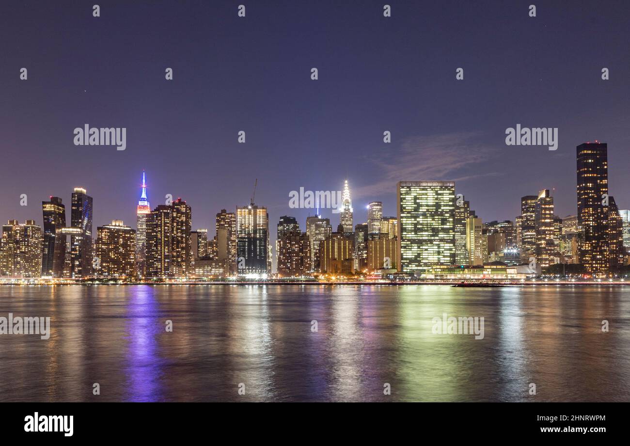 skyline view of New York with illuminated Empire State and Chrysler building. Stock Photo