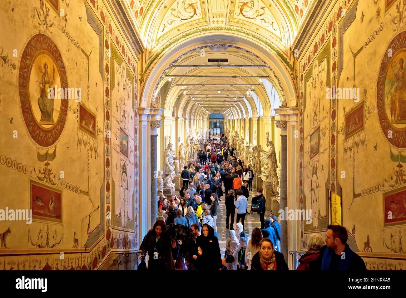 Vatican museum art hallway and tourist crowd view. Stock Photo