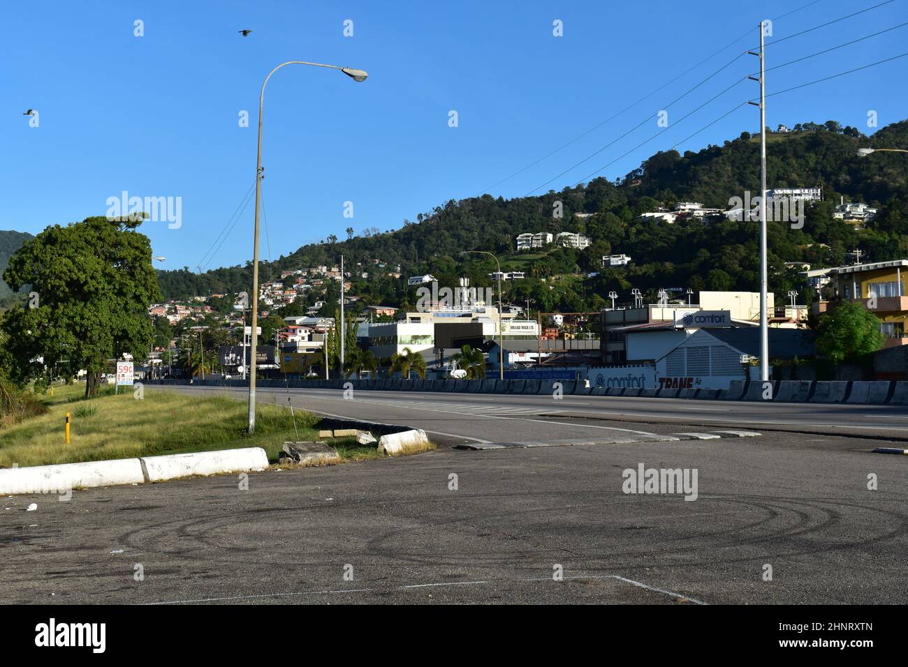 Mucurapo, Trinidad and Tobago-January 16, 2021: View of the roadway from the Mucurapo foreshore. Several commercial & residential buildings are seen. Stock Photo