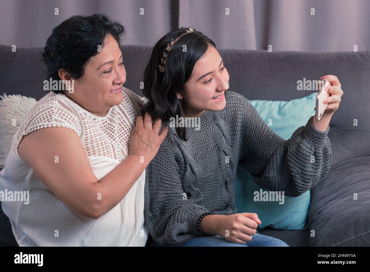 Older Woman 60 Year Old Latin Grandmother Using Cell Phone And Having 