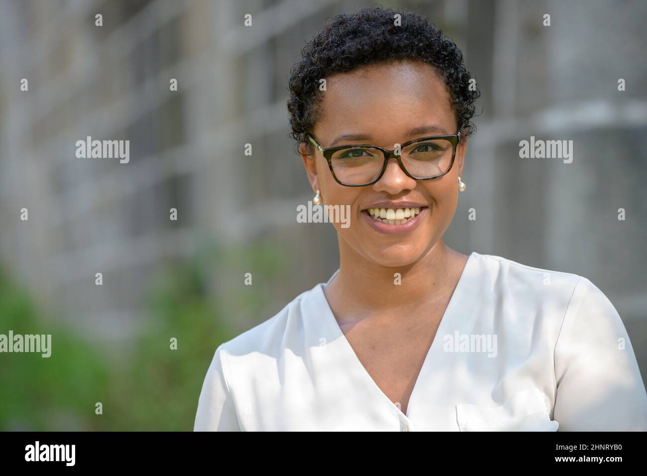 Beautiful african businesswoman smiling hi-res stock photography and ...