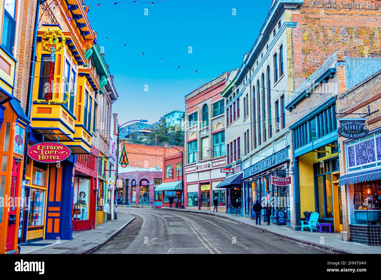Buildings lining Main Street on a clear day at the edge of Bisbee, Arizona. Stock Photo