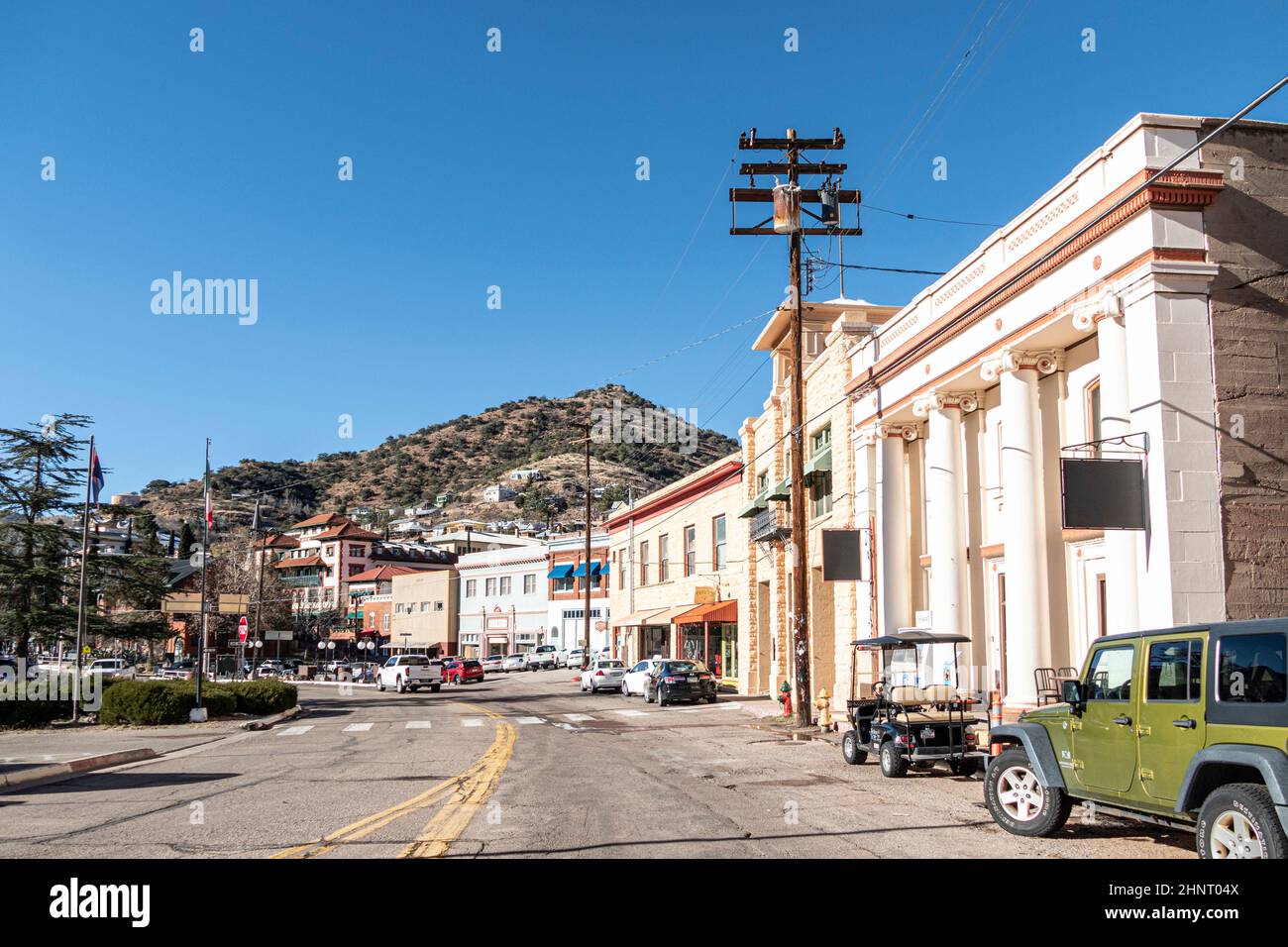 Buildings lining Main Street on a clear day at the edge of Bisbee, Arizona. Stock Photo