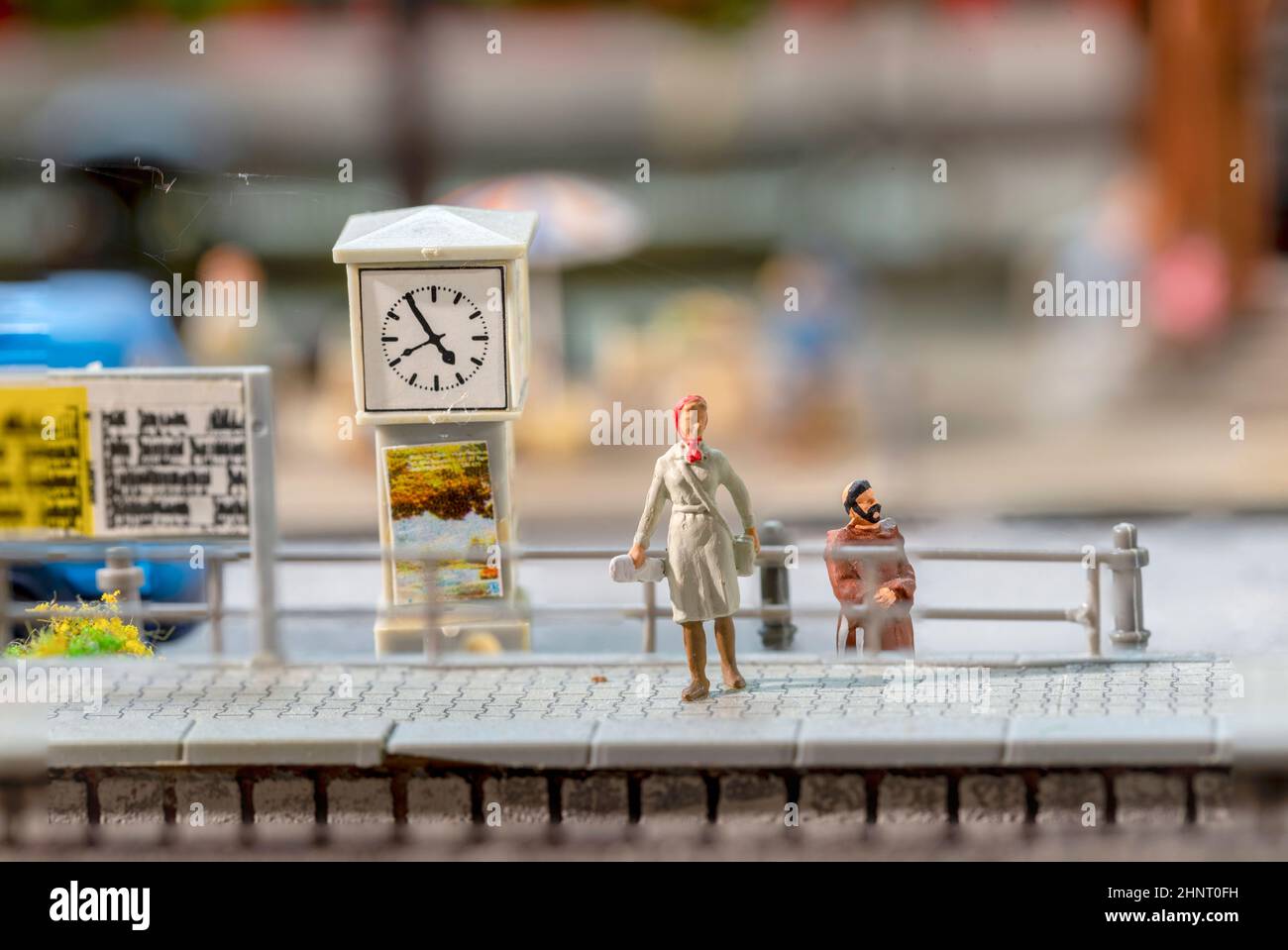 plastic man with dog waits at the train station in Bonn for the next train   at the scenic model lof the train station Stock Photo