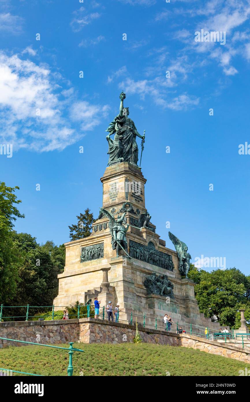Beautiful view of the monument Niederwalddenkmal. Tourists admiring the tall Germania sculpture . Stock Photo