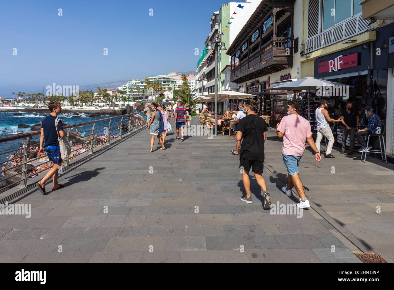 PUERTO DE LA CRUZ, TENERIFE, SPAIN - JULY 14, 2021: Promenade with vacationers and tourists. Stock Photo