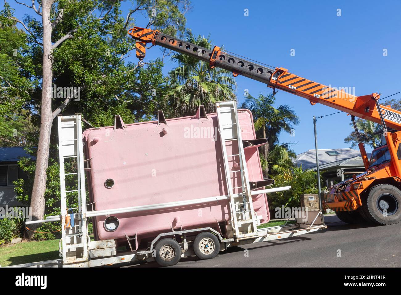 Fibreglass swimming pool for residential installation being delivered