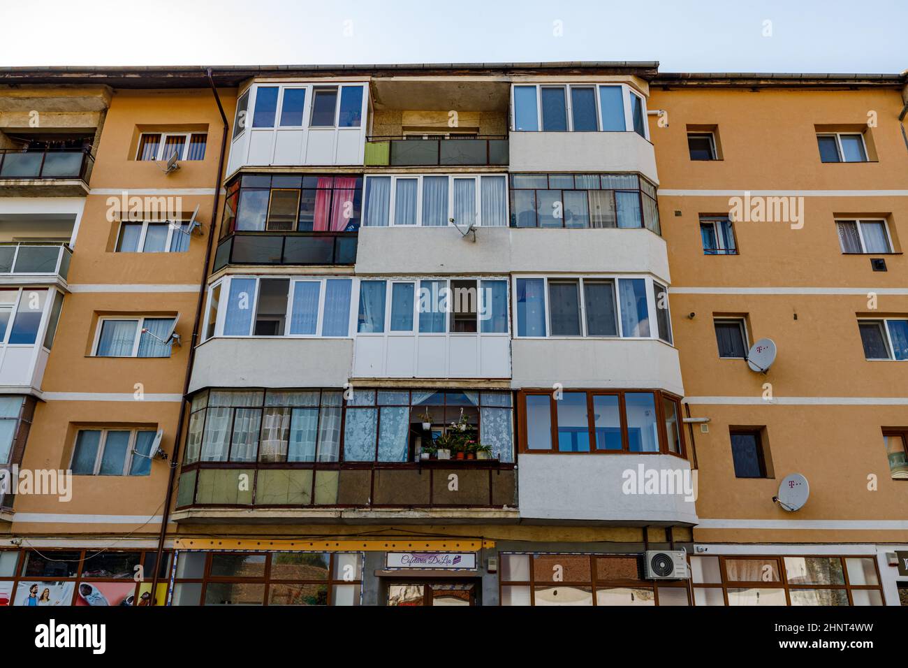 facade and windows of a old communistic house un romania Stock Photo