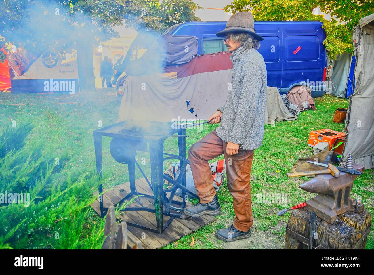 Street performer as blacksmith. Street performers can fool passersby and entertain tourists. Stock Photo