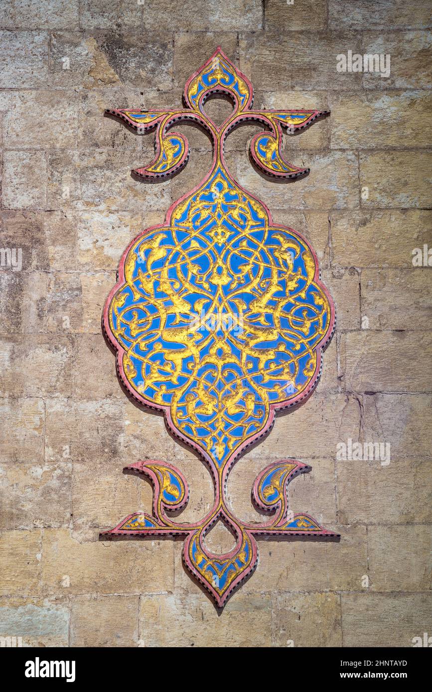 Golden and blue stucco floral patterns decoration carved into the wall of Al Rifai Mosque, Cairo, Egypt Stock Photo