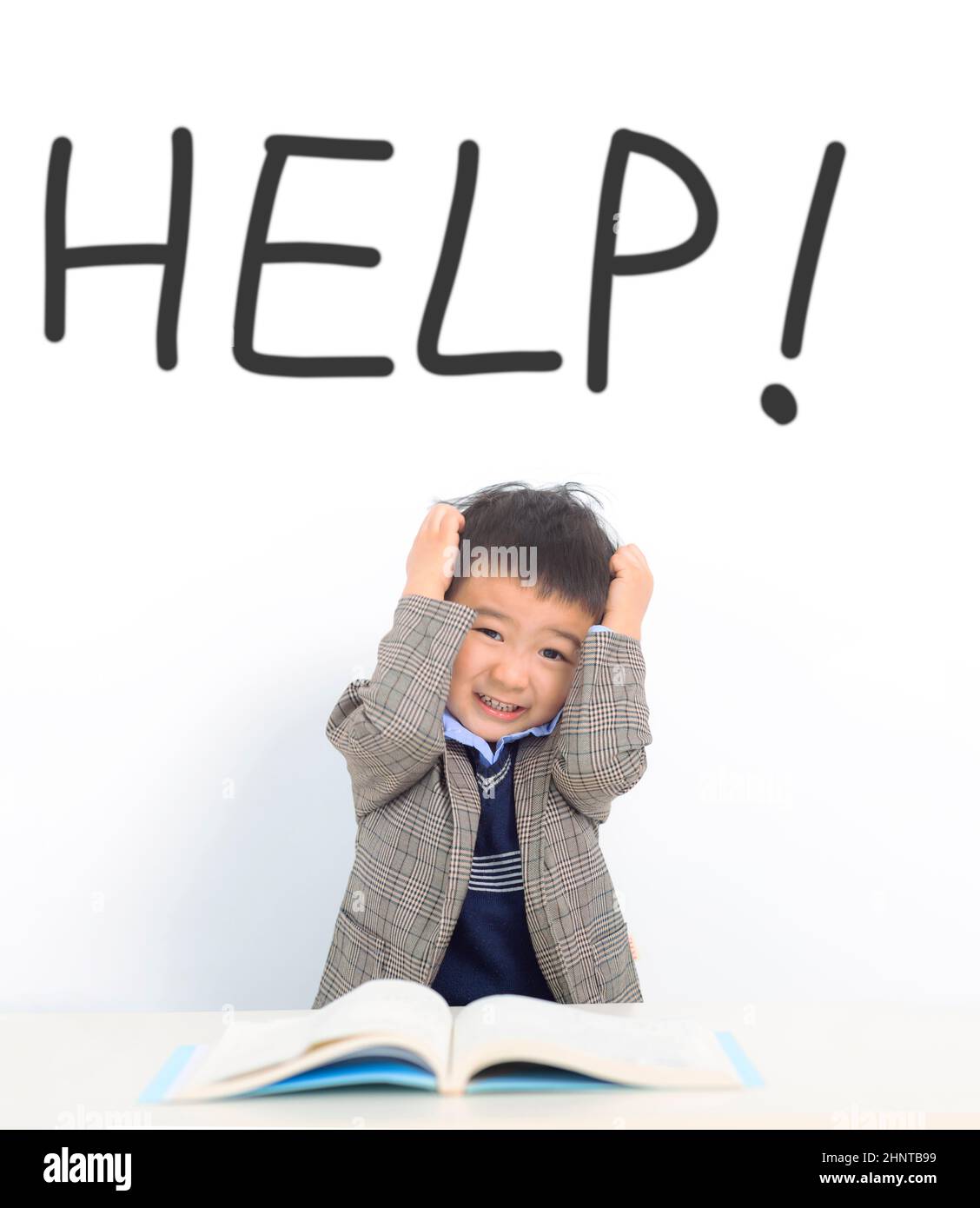 Stressed  kid need help during the study Stock Photo