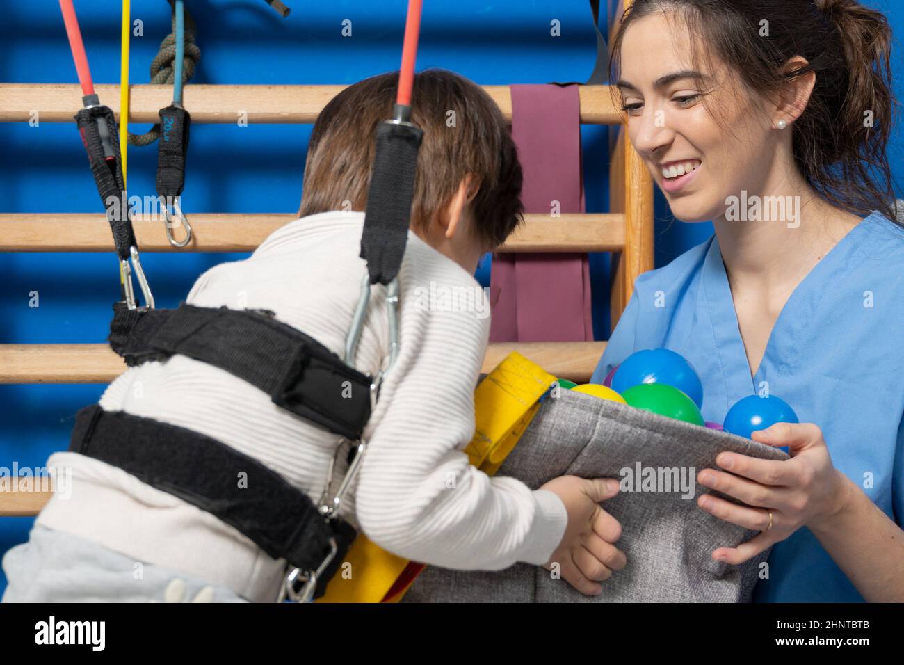 Disabled child is playing, learning and exercising in rehabilitation therapy hospital, Lifestyle of a child with disability. Happy disability kid concept. Stock Photo