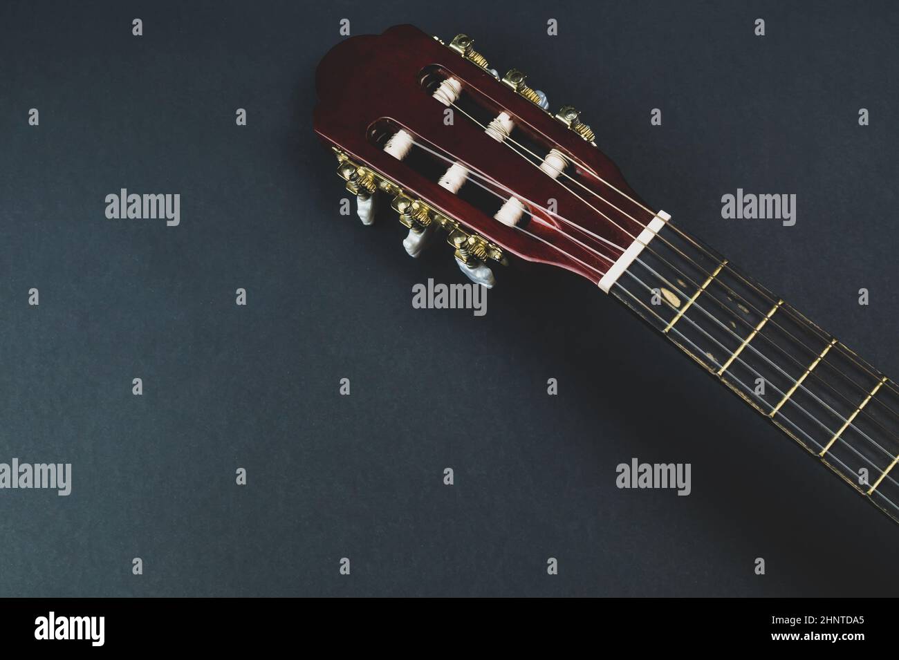 Guitar fretboard close up. musical instrument. strings on the guitar neck. copy space Stock