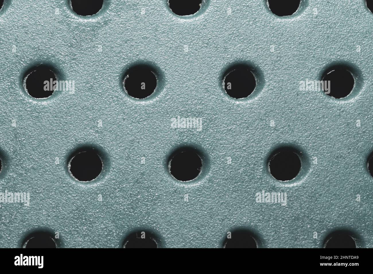 Holes in plastic surface. abstract pattern background Stock Photo
