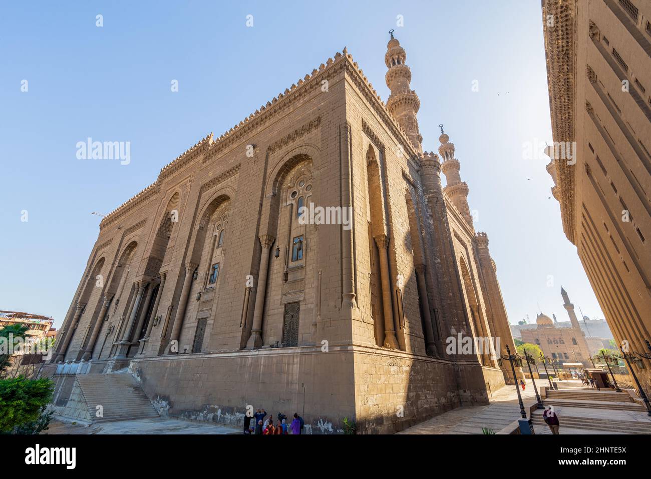 Facade of Royal era Mosque of Al Rifai, with side view of Mamluk era Mosque and Madrassa of Sultan Hassan, Cairo, Egypt Stock Photo