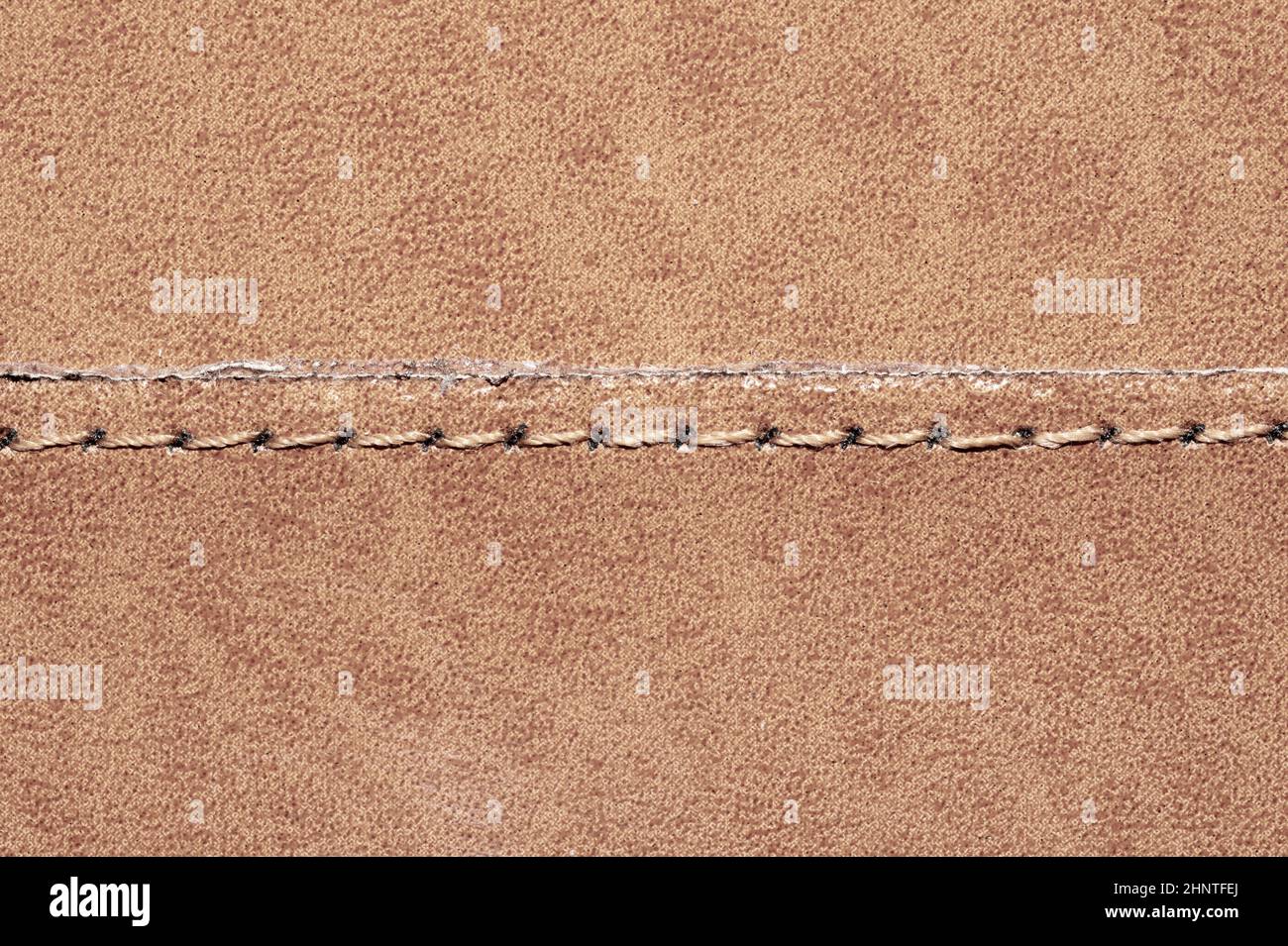 Brown leather texture with a linear stitch. material with seam Stock Photo