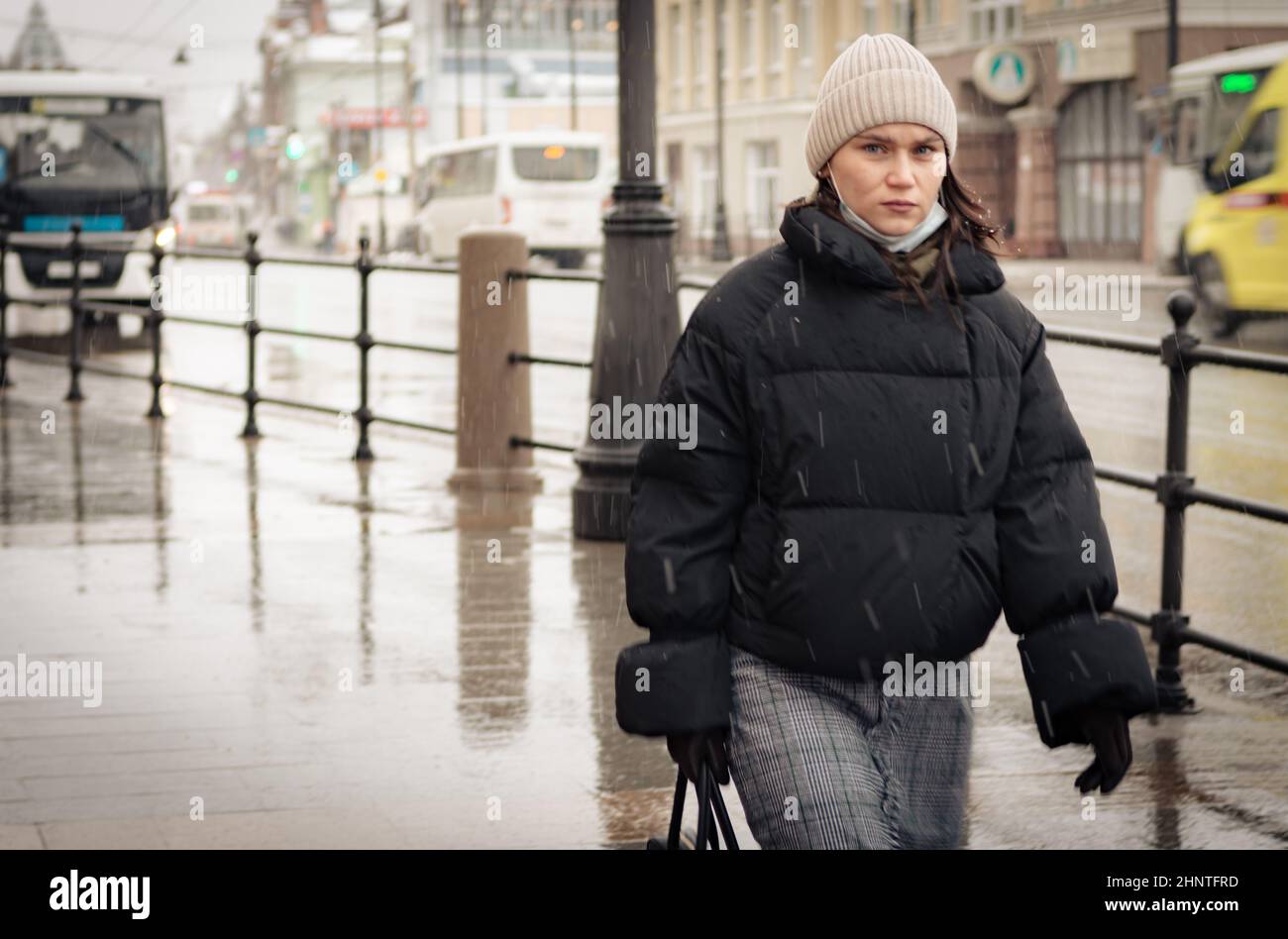 26th of October 2020, Russia, Tomsk, woman walk by the street Stock Photo