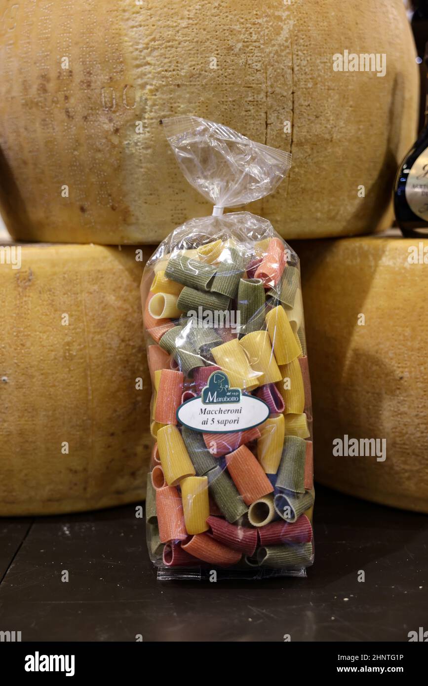 Whole wheel of Parmigiano Reggiano cheese and Italian pasta Stock Photo