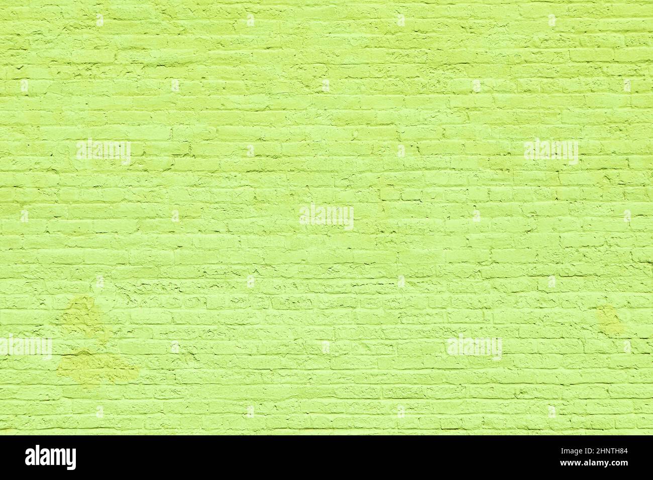 harmonic old brick wall painted in green as background Stock Photo