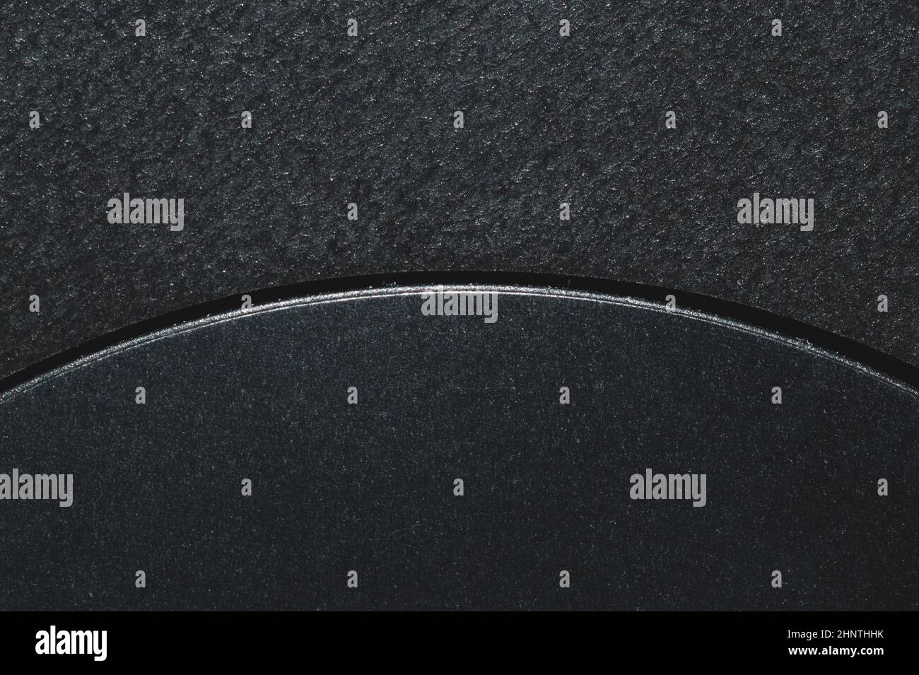 Black background with a curved slit. plastic texture macro Stock Photo