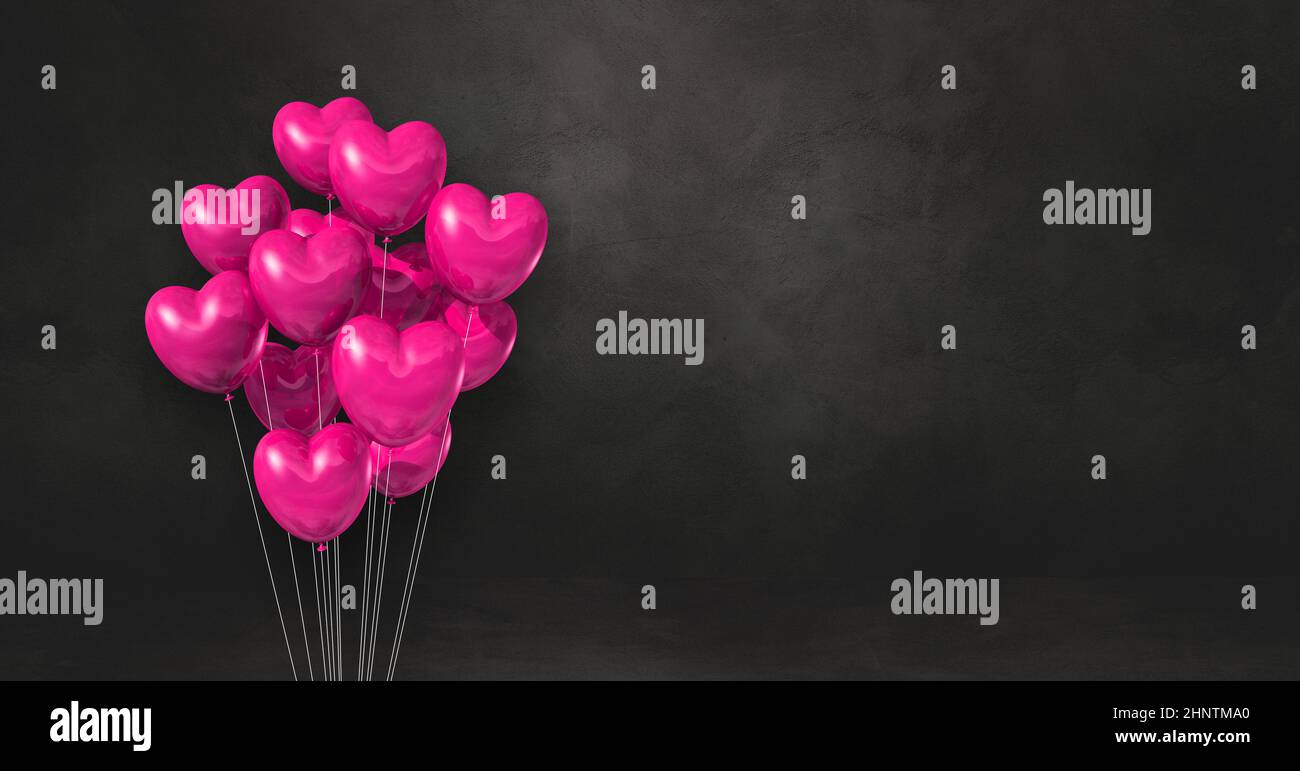 Pink heart shape balloons bunch on a black wall background. Horizontal ...