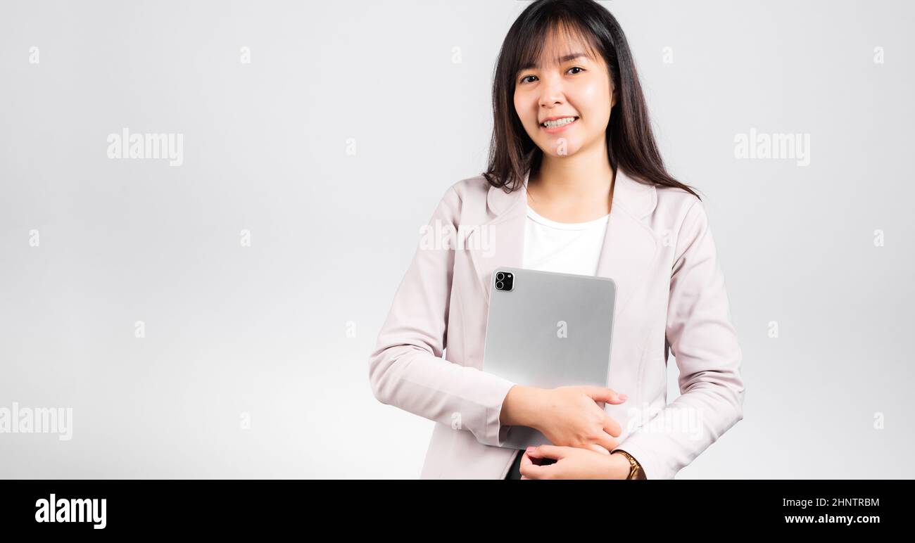 Portrait of Asian beautiful young woman smiling holding tablet computer ...