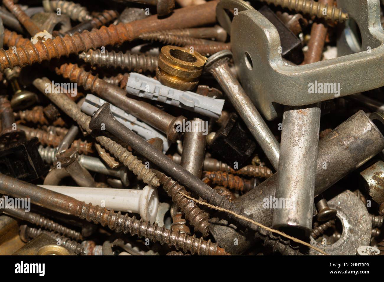 Old screws background. heap of tapping screws. work tool. pile of