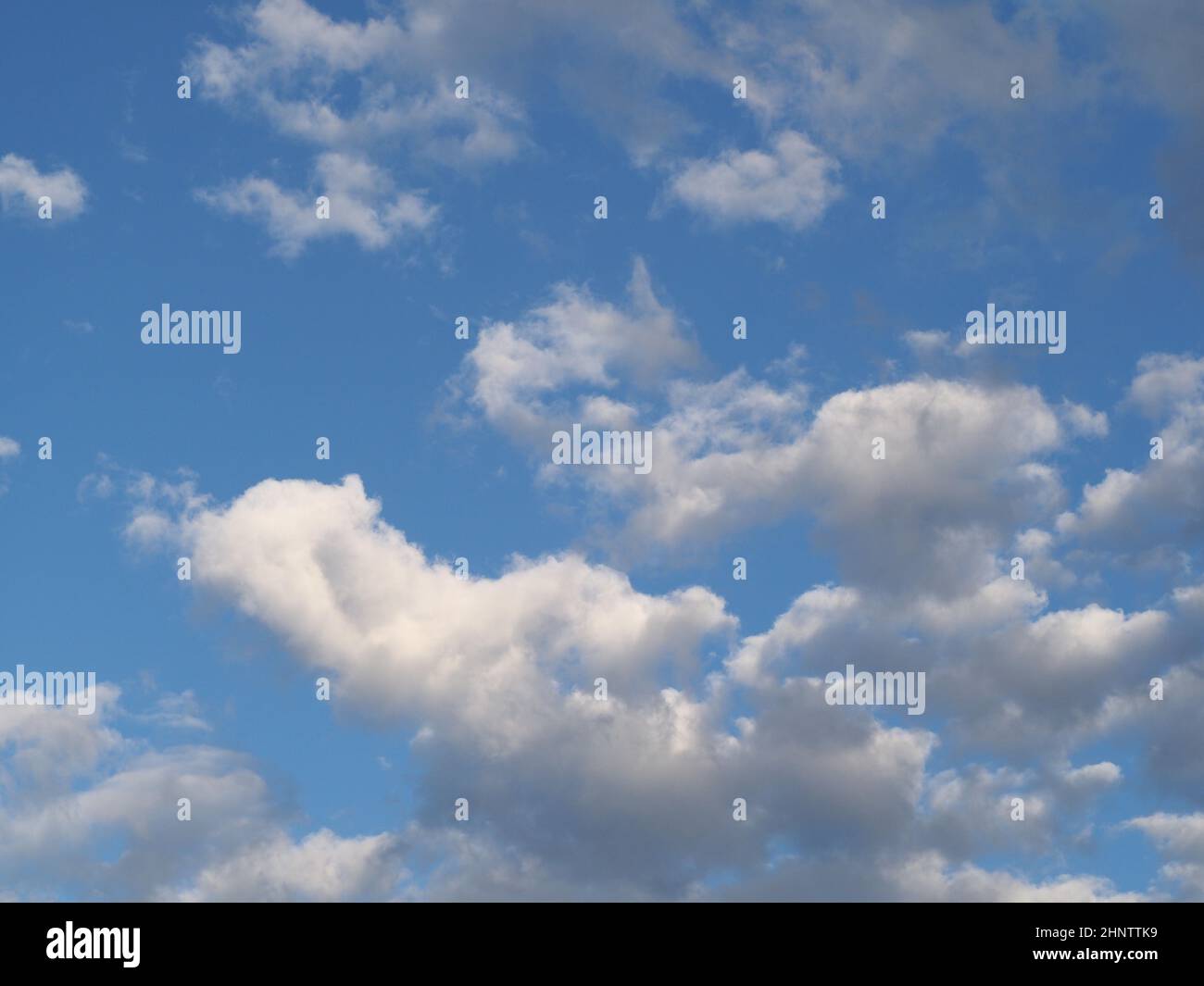 blue sky with clouds useful as a background Stock Photo - Alamy
