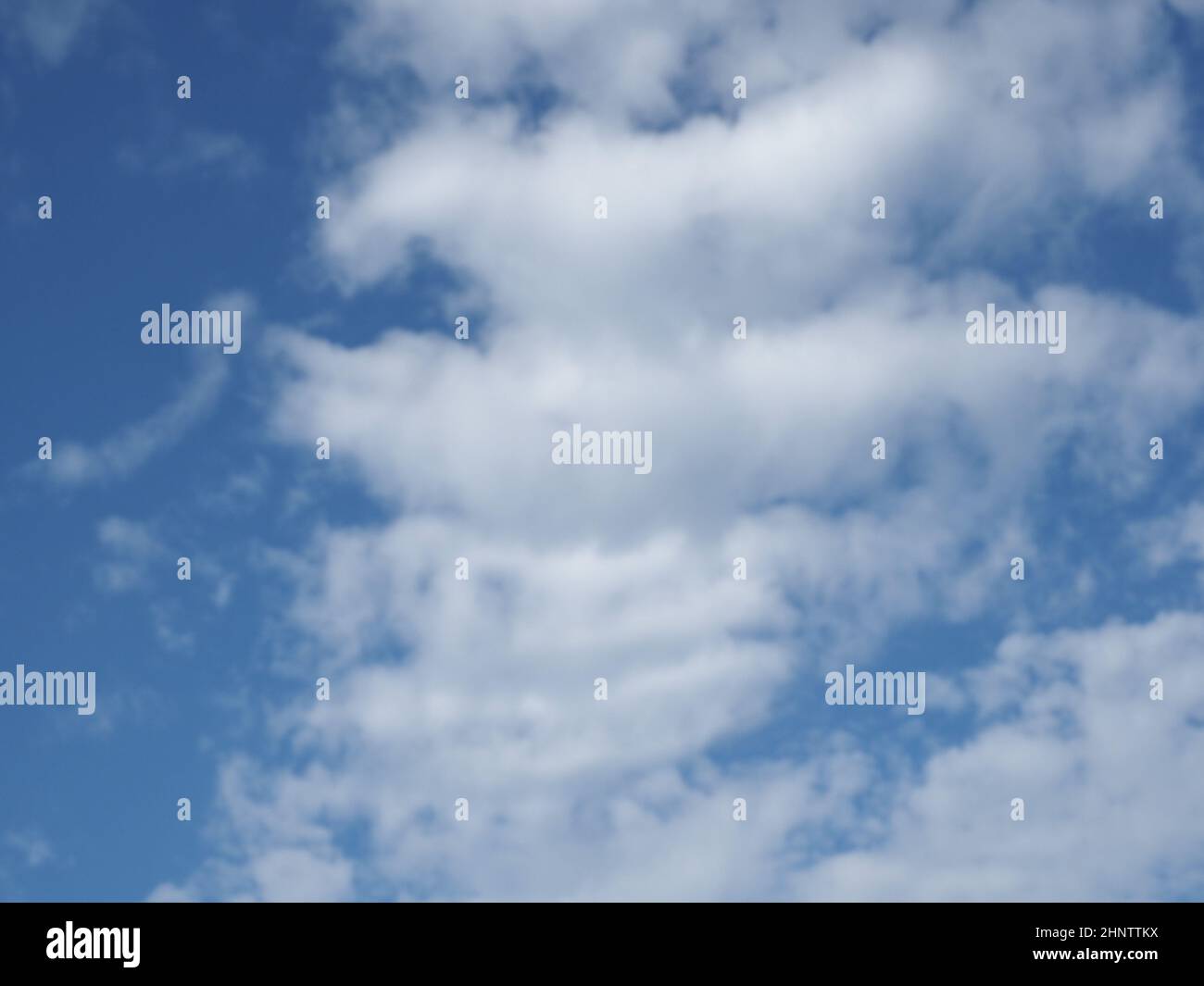 blue sky with clouds useful as a background Stock Photo - Alamy