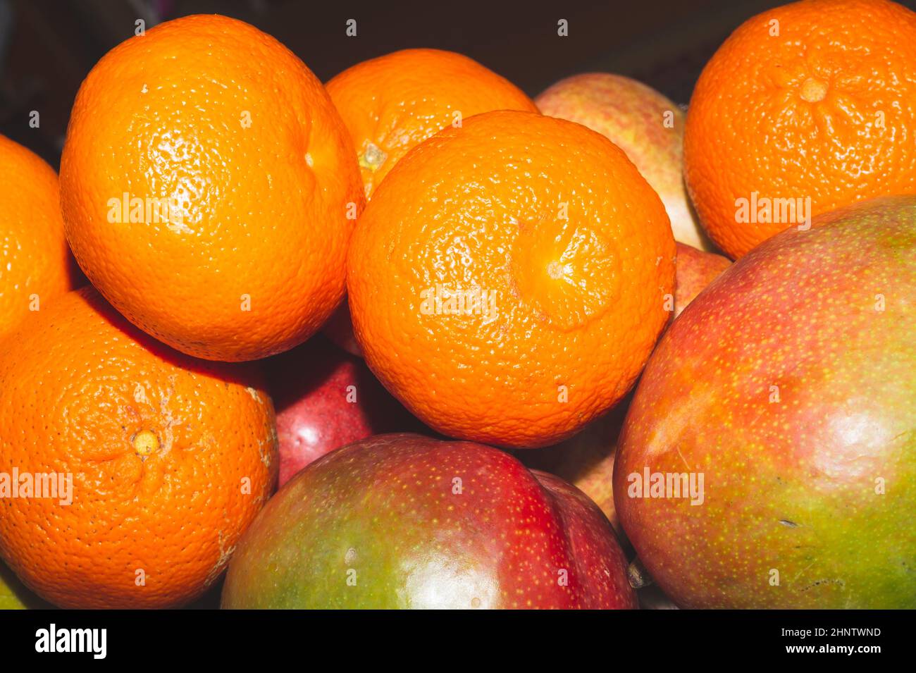 Mango and mandarins. natural looking fruits Stock Photo Alamy
