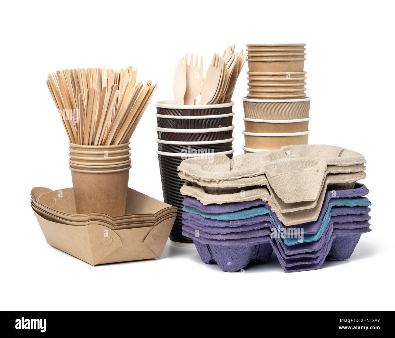 stack of brown disposable paper cups, wooden forks and knives, plate on ...