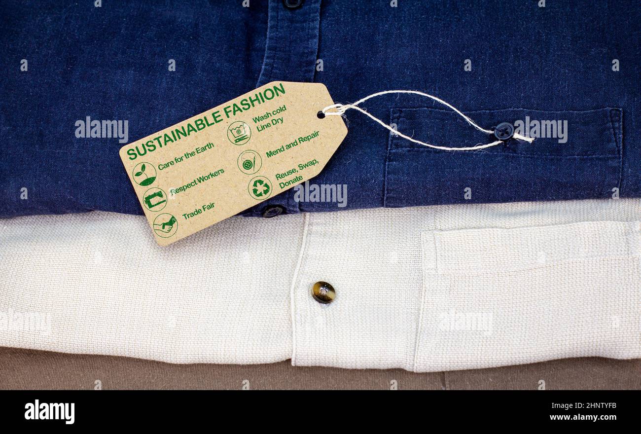 sustainable fashion label with care for the earth, respect for workers, trade fair, wash cold, line dry, mend and repair, reuse, swap or donate with i Stock Photo