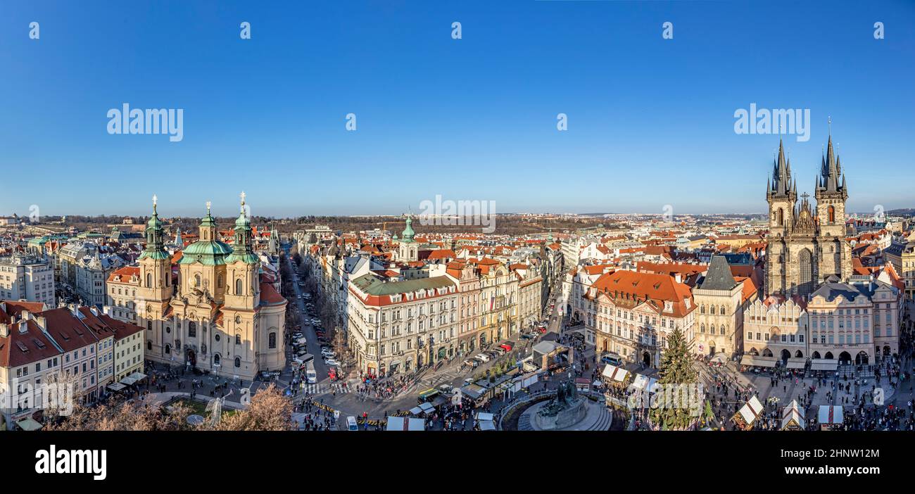 Old Town of Prague, Czech Republic. View on Tyn Church and Jan Hus Memorial on the square as seen from Old Town City Hall during Christmas market. Blu Stock Photo