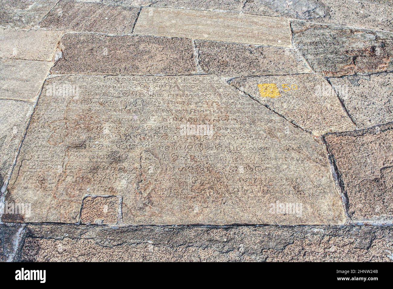 old historic inscription in the baseplates at the pagoda Isurumuniya ...